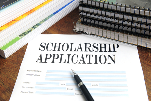 scholarship Picture of a scholarship application and ink pen